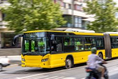 Modern city bus in motion. Yellow public vehicle. Speed blur effect Modern city bus in motion. Yellow public vehicle. Speed blur effect
